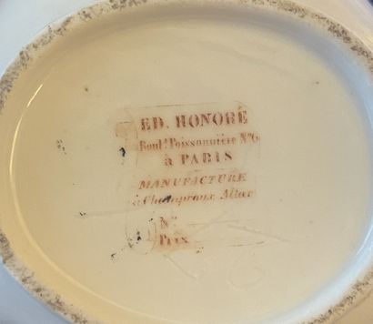null Edmond HONORE Paris. Polychrome and gold porcelain service with flower decoration,...