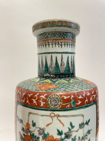 null Pair of polychrome porcelain scroll vases decorated with baskets of peonies...