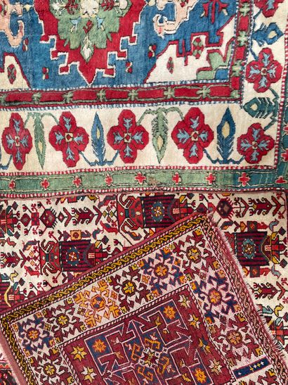 null Set of three Oriental wool carpets: one geometric in Caucasian red tones (110...