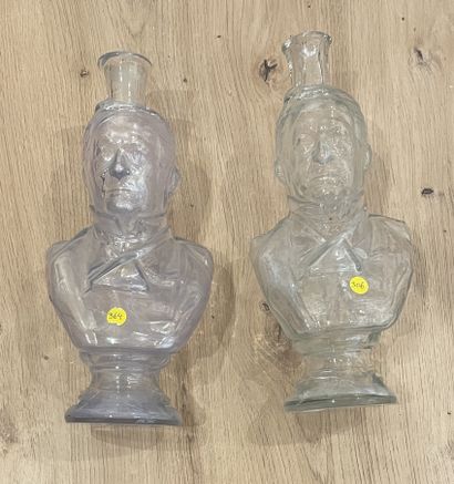 null Two anthropomorphic carafes in molded pressed glass. Height: 29 cm.