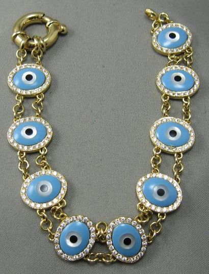 null Bracelet "yeux bleus" en or articulé, composé d'éléments stylisant des yeux...
