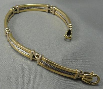 null Bracelet en or et acier, articulé de 5 éléments enrichis au centre d'un motif...