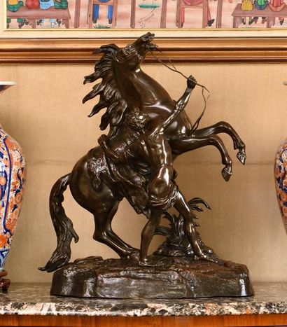 null D’après Guillaume COUSTOU, Cheval de Marly, Bronze patiné. Haut.: 61 cm.