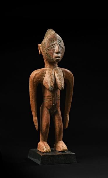 null Statue Mossi, Burkina Faso. Bois dur à patine brune, pigments rouges et noirs....