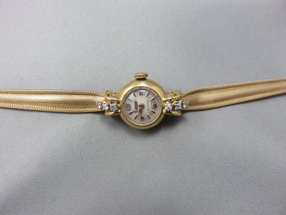 null Flamor. Montre Bracelet de Dame en or 18k, les attaches ornées de diamants taille...