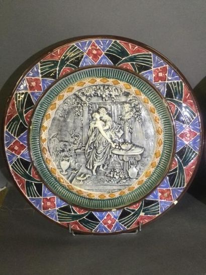 null Two large FLATs in polychrome earthenware: one decorated with an antique gallant...