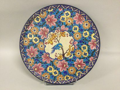 null LONGWY, earthenware pie plate with enamelled decoration of flowers and a bird...