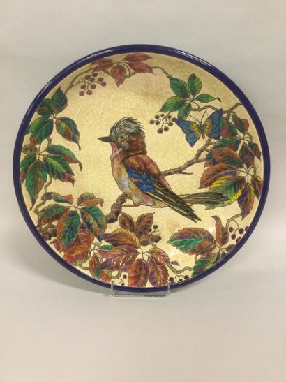 null LONGWY, Large circular dish with polychrome decoration of a jay on a cracked...