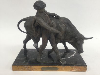 null Cast iron sculpture on a marble base, representing a peasant and his ox, ht....