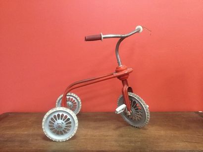 Red child's tricycle
