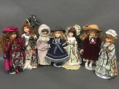 Set of 7 collectible dolls, ceramic head...
