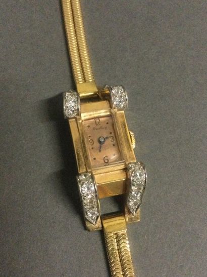 null BREITLING : montre de dame en or jaune 18k, cadran rectangulaire, boîtier agrémenté...
