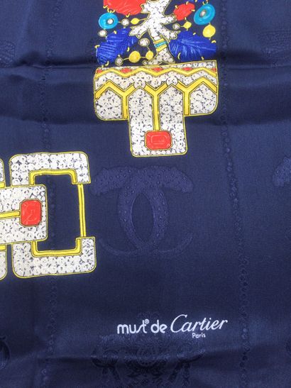 null Must of CARTIER, Two printed silk squares, the first one on a navy blue background...