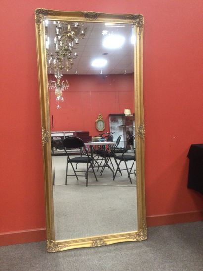 Modern mirror with gold frame and bevelled...