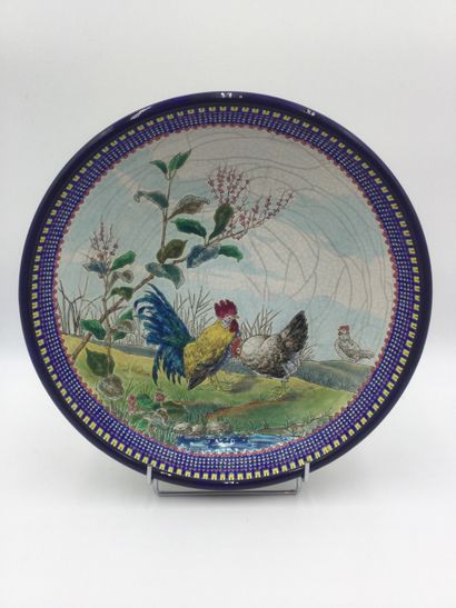null LONGWY, Large earthenware PLAT with enamel decoration in relief featuring two...
