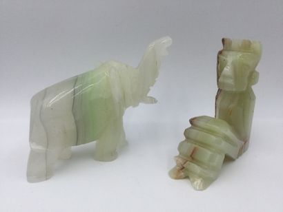 null Set of two subjects in hard stone (jadeite) representing an elephant and a stylized...