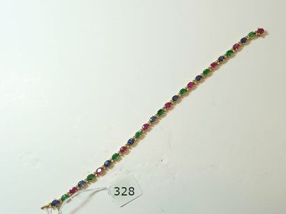 null Bracelet ligne en or jaune 18K (750/oo) agrémenté de rubis, d'émeraudes et saphirs...