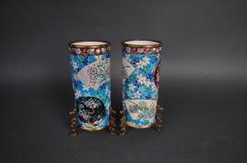 null LONGWY - Paire de vases rouleaux à décor de cartouches fleuris sur leurs socles...