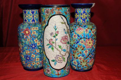 LONGWY, trois vases à décor polychrome de...