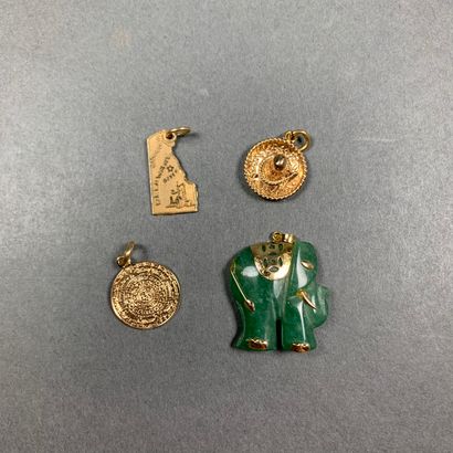 null Set of four pendants in 585 yellow gold, including a nephrite elephant, 12.4...