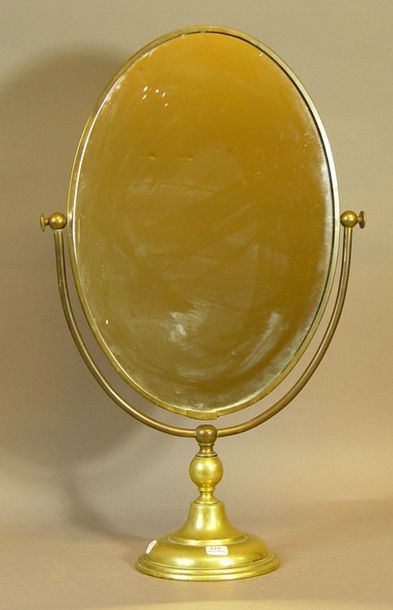 null 225- Miroir ovale, piétement en métal doré