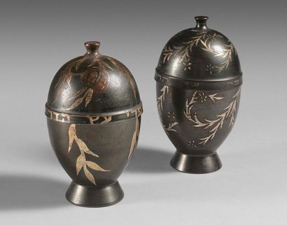 129- Two black lacquered metal covered ovoid...