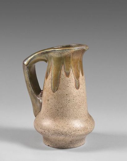 64- Enamelled stoneware pitcher 
Stamp and...