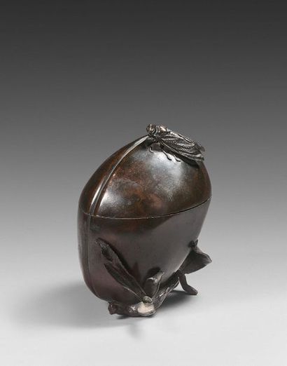88- Bronze covered box, peach shape on which...