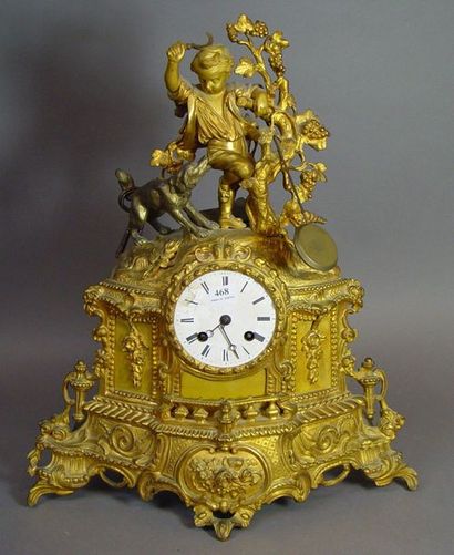 null 468- Pendule en bronze doré à décor d'enfant et chien

(manque le verre)

H...
