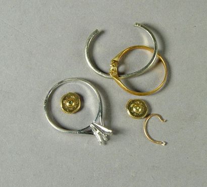 null 35- Scrap gold: ring mounts, earrings clasps

Weight: 6.4 g