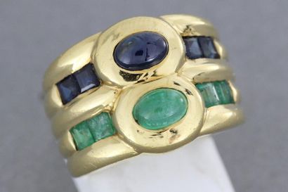 null 47- Gold ring set with a sapphire and an emerald cabochon shouldered with calibrated...