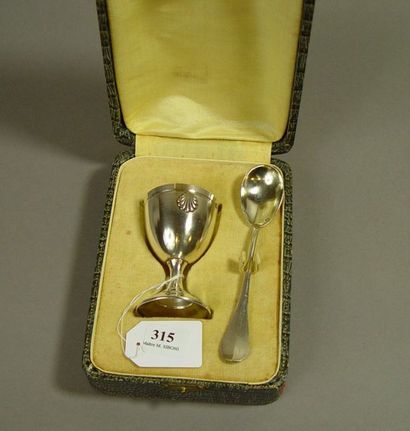 null 315- Silver egg cup with shell decoration and matching spoon, in their case...