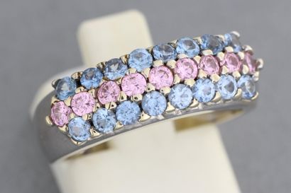 null 133- Gold ring set with a line of pink sapphires between two lines of blue sapphires

Wt:...