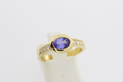 null 106- Gold ring set with a sapphire surrounded by lines of diamonds

Weight:...