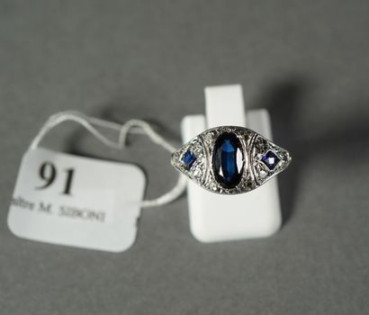 null 91- White gold and platinum Dome ring set with an oval synthetic sapphire in...