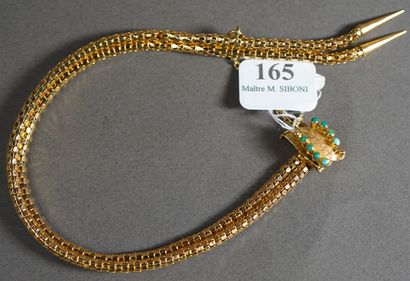 null 165- Bracelet souple en or jaune Fermoir à décor de feuille serti de turquoises...