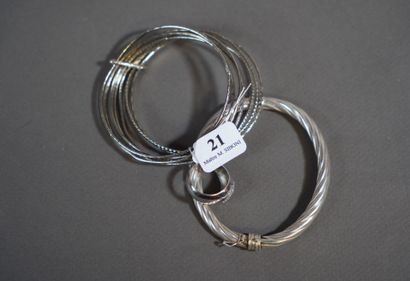 21- Two silver bracelets. A silver ring with...