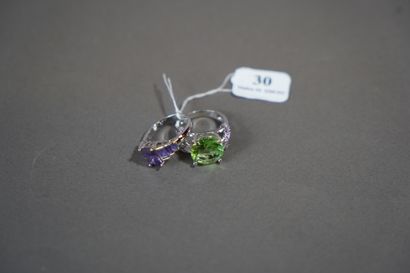 30- Two silver rings set with green and purple...
