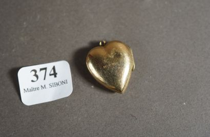 374- Pendentif/porte-photo ''coeur'' en or...