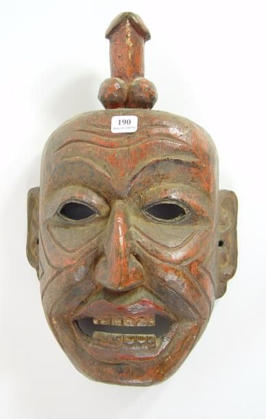 null Masque en bois polychrome surmonté d'un phallus
Hauteur: 34 cm