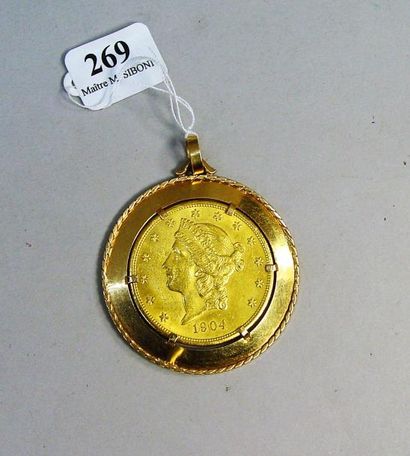 null 269- Pièce de 20 dollars montée en pendentif, monture en or jaune

Pds net :...