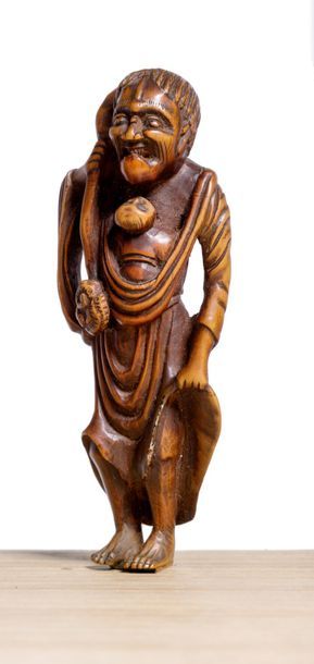JAPON 
Grand netsuke en bois, Sennin portant un enfant dans une écharpe, tenant d'une...