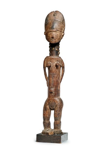null Sculpture féminine en bois à patine foncée
Baoulé, Côte d'Ivoire XXème
H: 47...