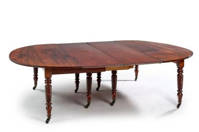 null Moulded mahogany oval table with flaps and extensions resting on 8 twisted legs...