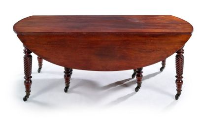 null Moulded mahogany oval table with flaps and extensions resting on 8 twisted legs...