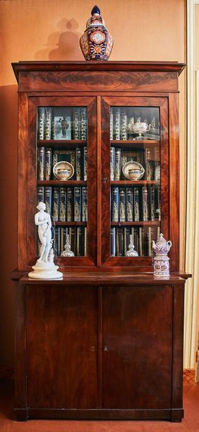 null Mahogany and mahogany veneer bookcase opening with two glazed leaves in the...