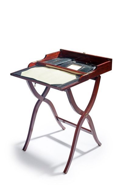 null Folding officer's desk in varnished wood, desk pad and storage covered with...