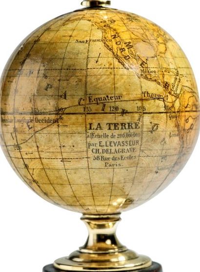 null Small polar-mounted study globe on a blackened wooden stand.
Signed E. LEVASSEUR,...