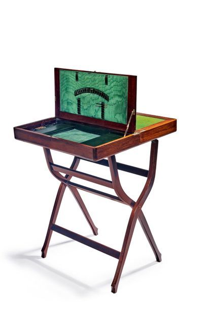 null Foldable travel desk in varnished wood with three uses. The central opening...