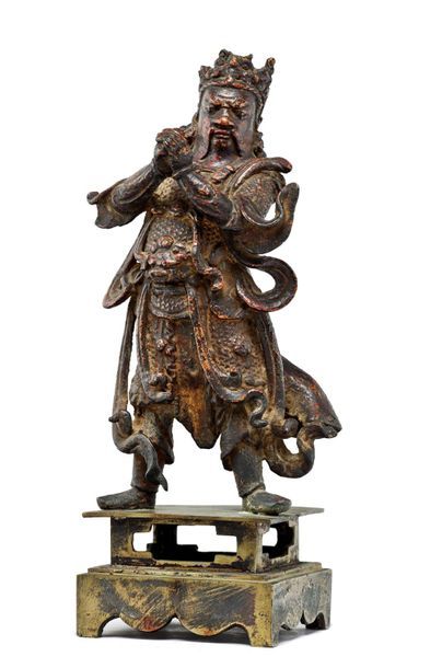 CHINE - Epoque MING (1368 - 1644) 
Bronze statuette with brown patina partially lacquered...